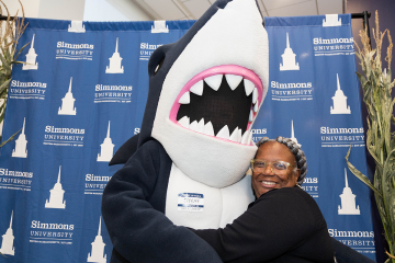 Stormy the Shark giving out hugs during Alumnae, Family, and Friends weekend