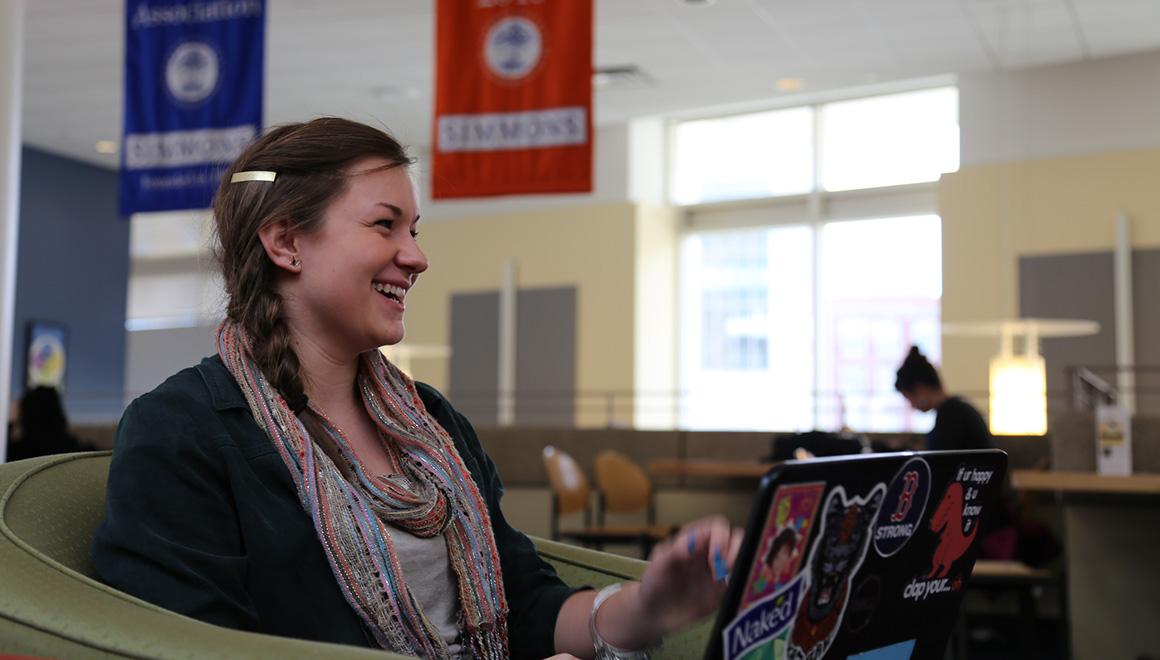 Student sitting with their computer