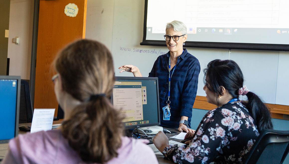 Professor Nanette Veilleux teaching a class of Simmons University students