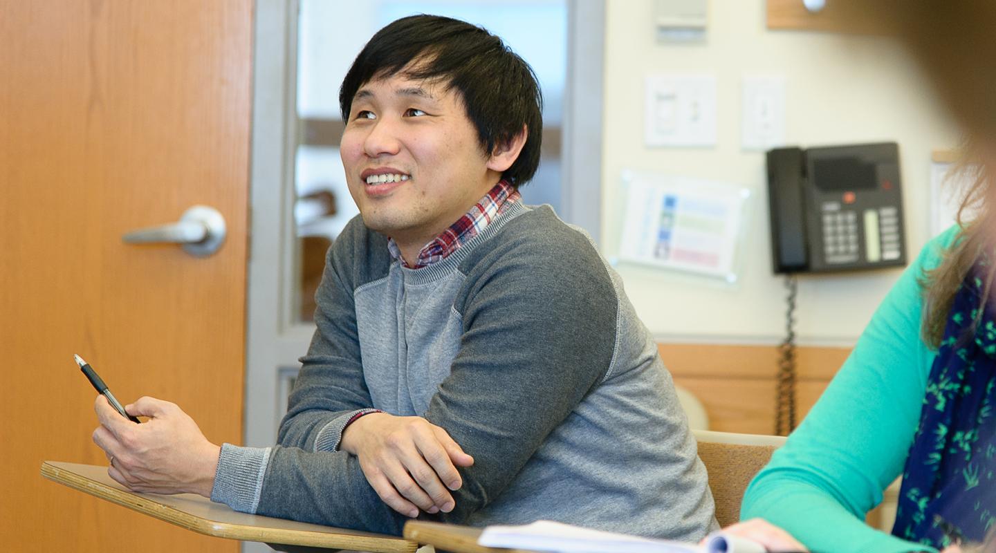 Graduate student sitting in class