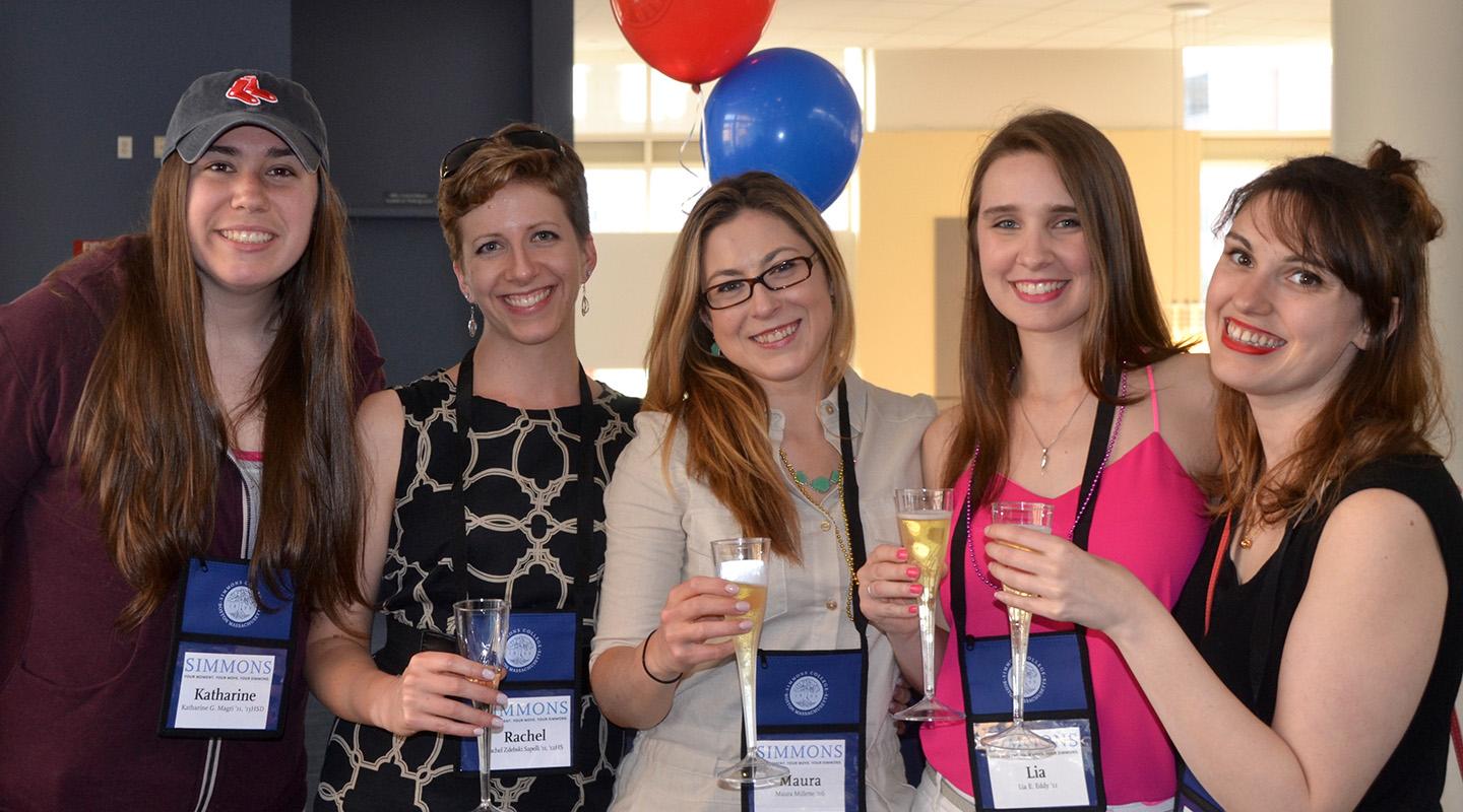 Alumns posing for photo at event