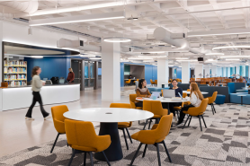 Students seated at tables in the Simmons University Library