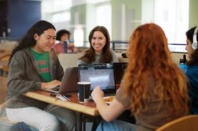 Students sitting in a common area at Simmons