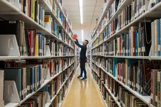 Student in the stacks