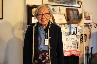 100-year-old Isabelle Chang '46, who says reading is the secret to a happy life. Photo credit: Evan Walsh, Community Advocate