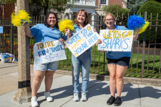 Orientation leaders giving a cheer for the first year students on move-in day