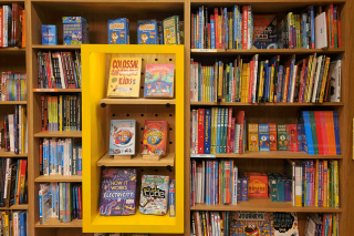 Shelves full of children's books. Photo by Zoshua Colah on Unsplash.  