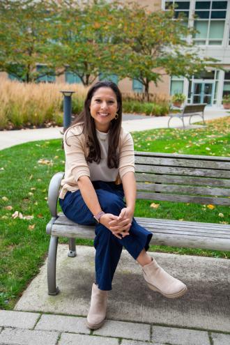 Allegra Egizi '18, '20MS enjoys a fall day on the Simmons campus, photograph by Ashley Purvis.