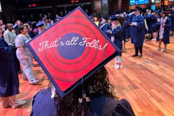 Commencement cap with the message “That's all Folks!”