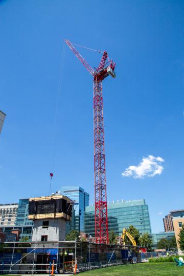 The crane on the construction site of the new Living and Learning Center at Simmons University