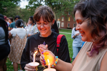 Simmons first-year students enjoying the candle lighting event