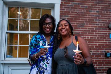 President Wooten holding a candle during the candle lighting event