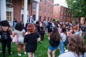 A large group of students gathered together for the candle lighting event during move-in weekend