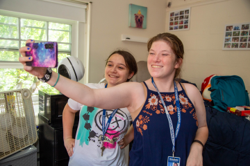 Two roommates take a selfie during move-in day 2024