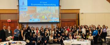 A large group of students and alums at the ECONnect event in 2024