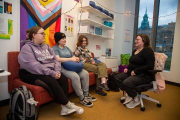 Simmons students talking together in the LGBTQIA resource center