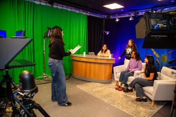 Simmons students working together in the student driven media center