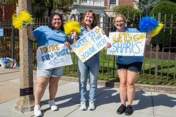 Orientation leaders giving a cheer for the first year students on move-in day