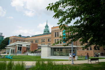 The Simmons academic quad, with students walking on the sidewalks