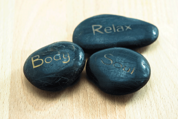 Three wellness stones.  One is imprinted with Body, one with Relax, and one with Soul.