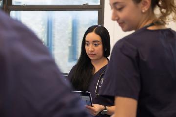 Nursing students working in the simulation lab