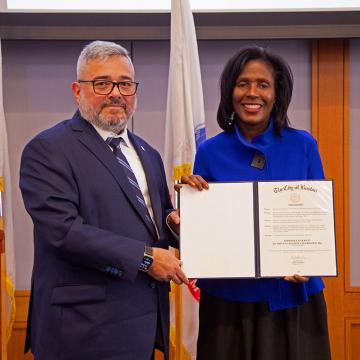 Robert Santiago, Commissioner of Veterans’ Service for the City of Boston presents a proclamation to President Lynn Perry Wooten