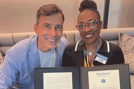 Dean Michael LaSala and Professor Vanessa Robinson-Dooley holding her 2024 Faculty Award