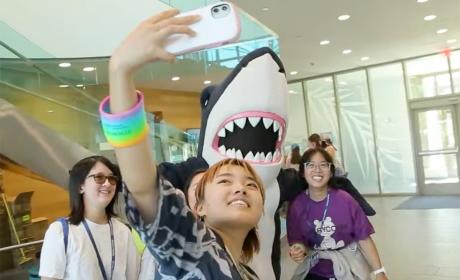 Students taking a selfie with Stormy, the Simmons mascot