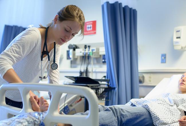 Students working in the nursing simulation lab