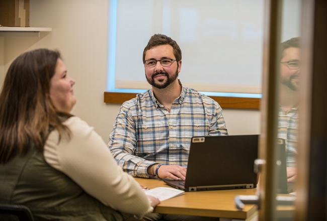 Advisor working with a student