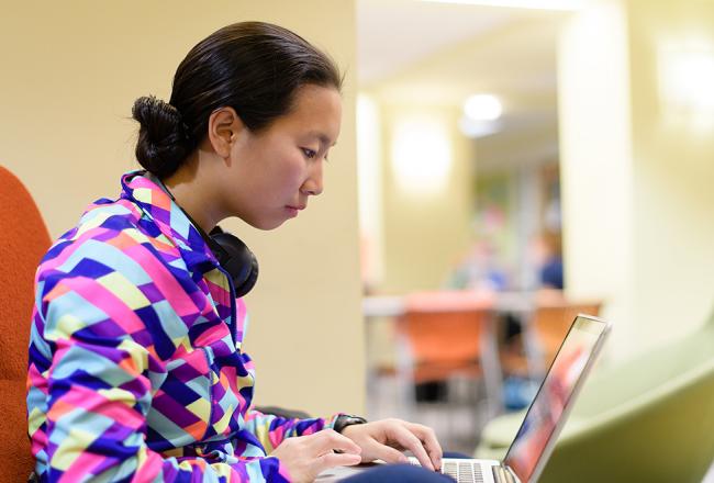 Student working on their laptop in the Student Activities Center