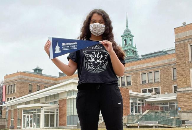 Simmons University student standing on the Academic Quad at Simmons University in Boston, Massachusetts