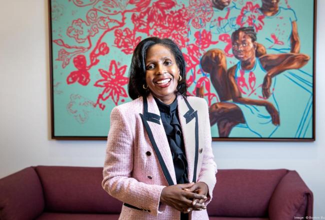 Simmons University President Lynn Perry Wooten wearing a pink jacket and smiling