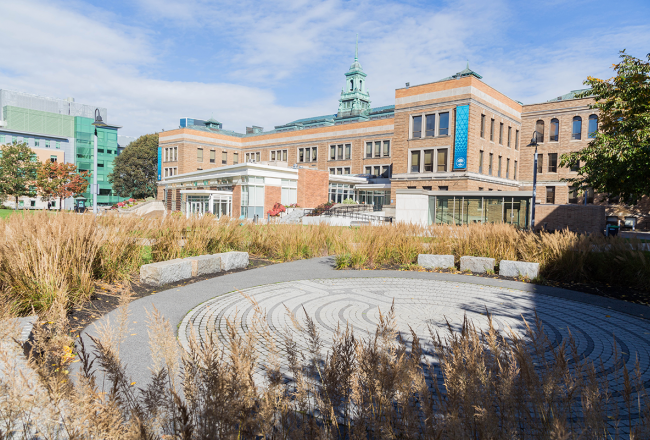 The Simmons University campus with the brick labyrinth in the foreground and the main campus building in the background