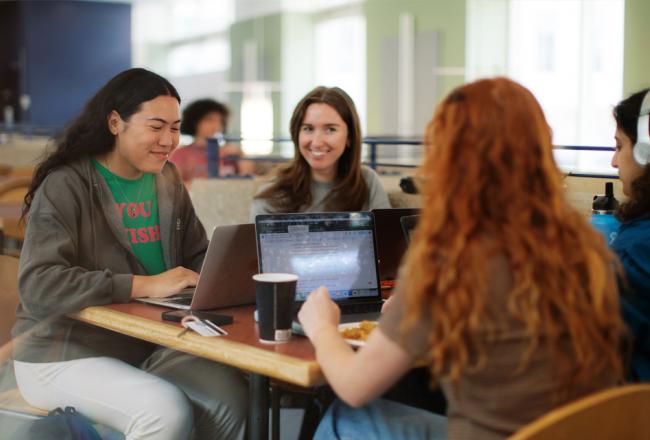 Students sitting in a common area at Simmons