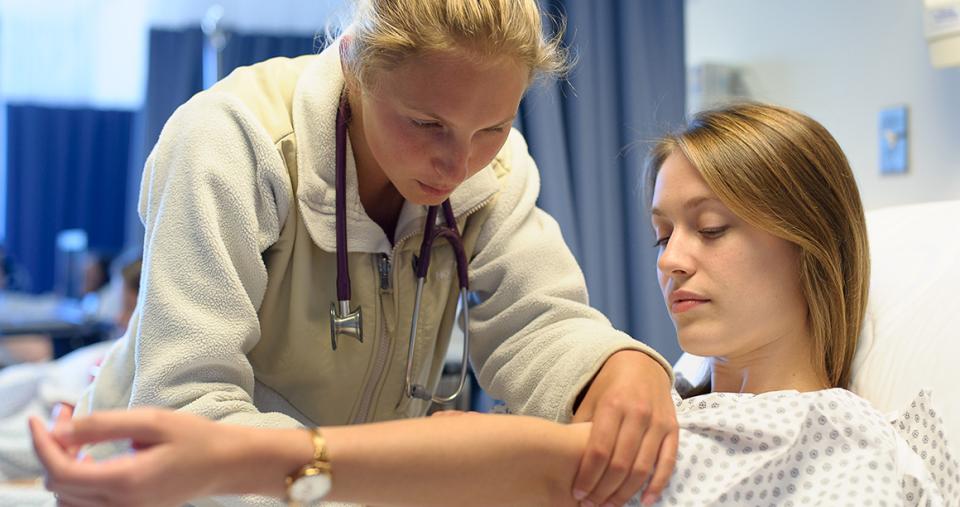 Students in a nursing simulation lab