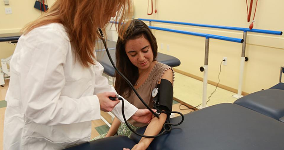 Dietetic Internship student taking a blood pressure reading