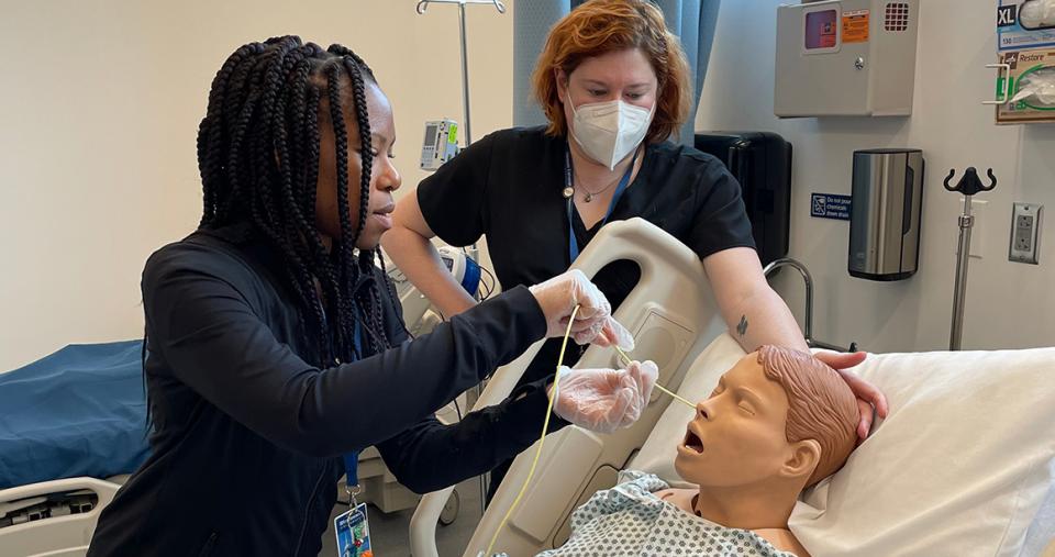 Students working on test patient mannequin