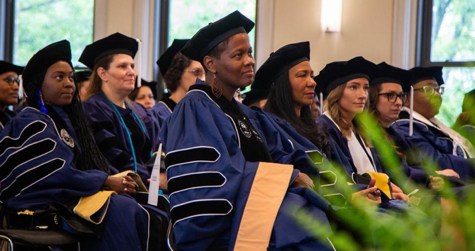 Doctoral candidates in attendance at the Doctoral Hooding Ceremony